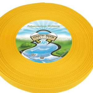 May include: A roll of bright yellow polypropylene webbing. The label reads "Country Brook Design" and "Polypropylene Webbing".