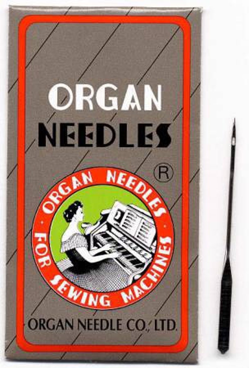 May include: A package of Organ Needles for sewing machines. The package is red and white with a black and white illustration of a woman playing a piano. The text on the package reads "Organ Needles for Sewing Machines" and "Organ Needle Co., Ltd.".