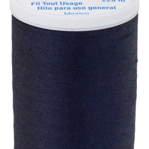 May include: A spool of navy blue all-purpose thread. The white top of the spool has the text "Dual Duty XP" and "COATS". The spool contains 250 yards of thread.