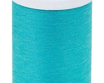 May include: A spool of turquoise blue Coats Dual Duty XP all-purpose thread. The spool is labeled with 250 yards (229 meters) and "Fil Tout Usage" and "Hilo para uso general".
