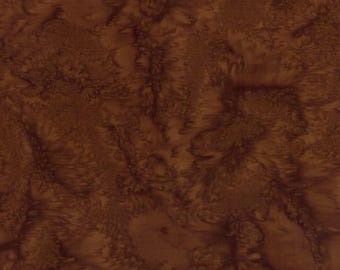 May include: A square piece of fabric featuring a mottled, tie-dye pattern in various shades of deep brown and chocolate. The surface displays organic, cloud-like swirls and dark, intricate veining that create a textured, marbled appearance throughout.