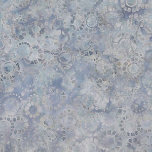 May include: A blue and white fabric with a repeating pattern of circles and dots. The fabric has a subtle tie-dye effect.
