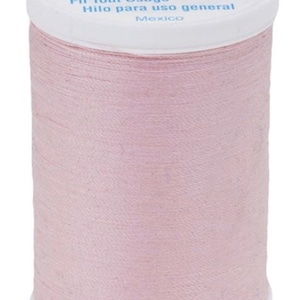 May include: A spool of pink Coats Dual Duty XP all-purpose thread, 250 yards (229 meters). The spool is labeled "Fil Tout Usage" and "Hilo para uso general".