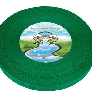 May include: A roll of green polypropylene webbing. The label reads "Country Brook Design" with a blue river and green grass.