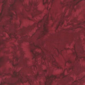 May include: A close-up of a fabric with a marbled pattern in shades of deep red and burgundy. The fabric has a textured appearance, with swirling, organic shapes creating a dynamic visual effect. The overall aesthetic is rich and luxurious.