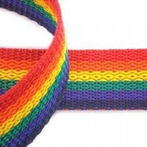 May include: Rainbow woven webbing with a diamond pattern. The webbing is red, orange, yellow, green, blue, and purple.