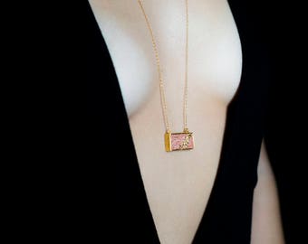 Contemporary necklace with gold leaf on pink concrete, in a gold plated brass bezel, 925 silver chain, swarovski crystals