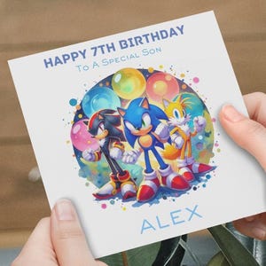 A beautifully designed Sonic birthday card, a vibrant water colour Sonic walking with confidence holding a ballon with a personalised number on it. Reads thappy birthday to a wonderful son, personalisd name, Sonic Shadow, Tails