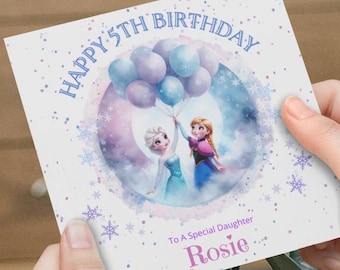 May include: A white card with a purple and blue watercolor background featuring the characters Elsa and Anna from the movie Frozen. The card says "Happy 5th Birthday" and "To A Special Daughter Rosie".