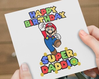 May include: A white card with a colorful "Happy Birthday" message and a cartoon image of Super Mario jumping. The text "Super Daddi" is below Mario, with gold coins surrounding the text.