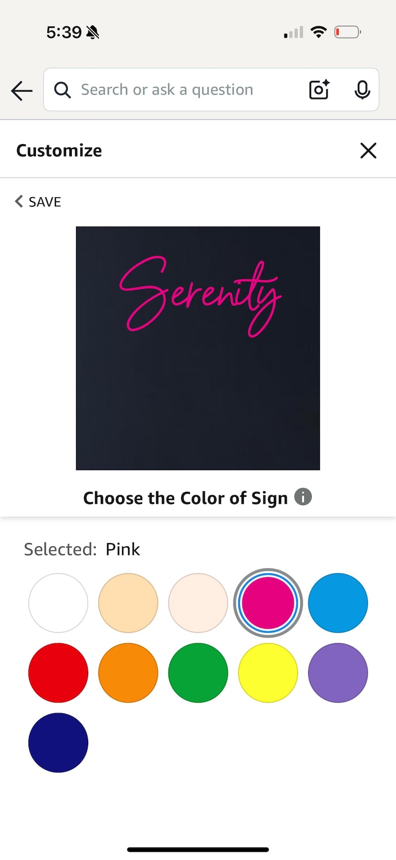 May include: A customisable sign with the word "Serenity" in a cursive font, displayed in pink against a dark background. Colour options are shown below the sign.
