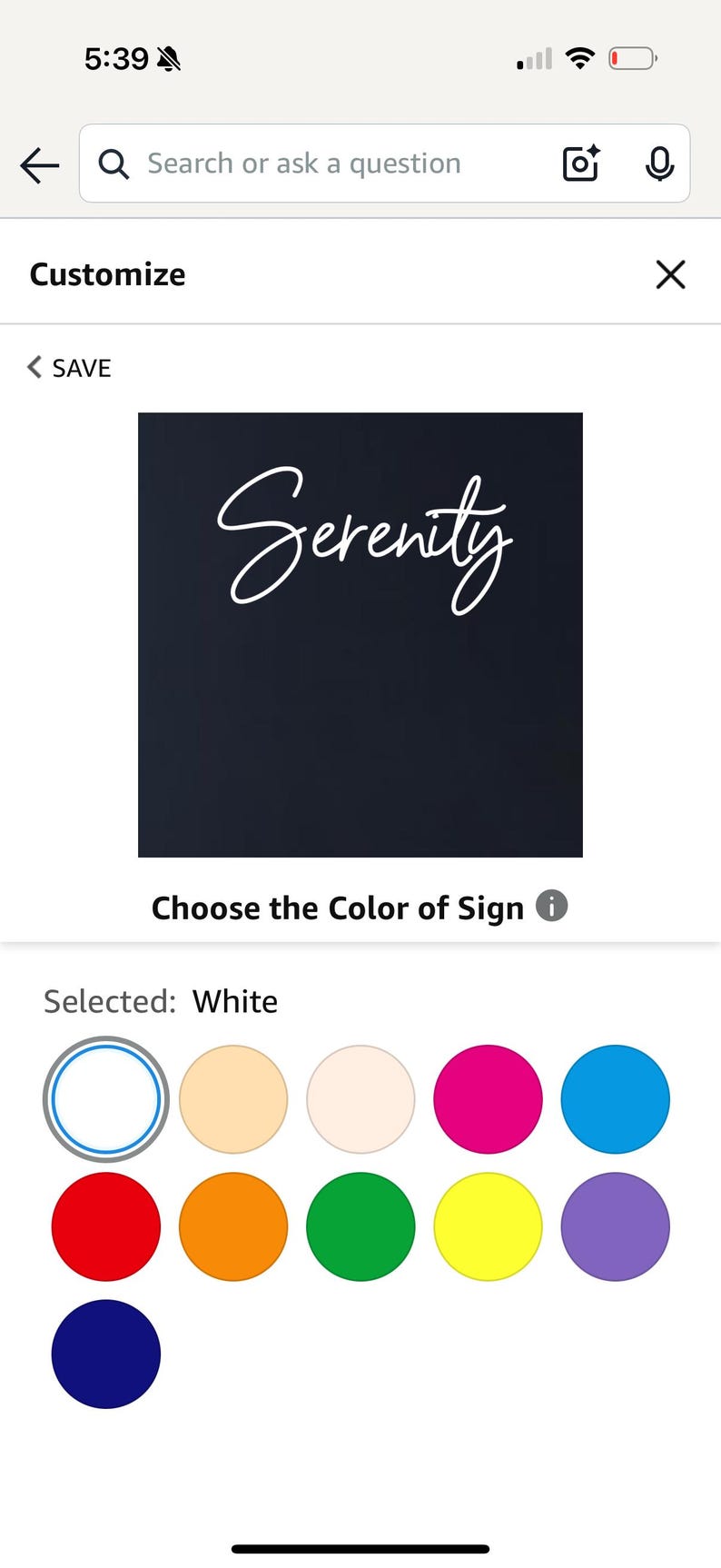 May include: A digital interface shows a black background with the word "Serenity" in white script. Below, colour options are displayed, with white selected. The screen is for a customisable sign.