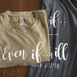 May include: Two t-shirts with a matching design. The green t-shirt says "even if..." and the gray t-shirt says "if...will" with the text "AKUK 3:17-18" below.