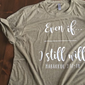 May include: A green t-shirt with the text "Even if... I still will" and "Habakkuk 3:17-18" printed in white.