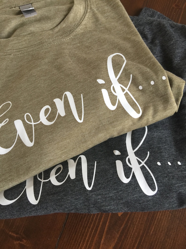 May include: Two t-shirts, one olive green and one dark gray, with the text "even if..." printed in white on each.