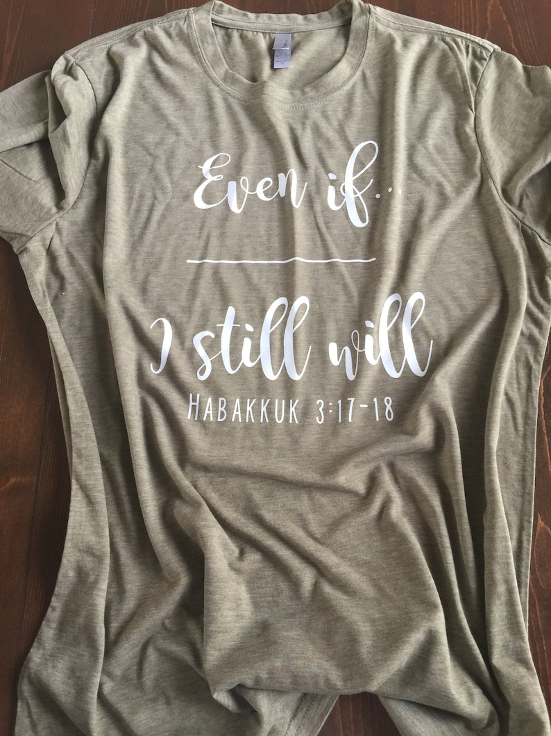 May include: A green t-shirt with the text "Even if... I still will" and the scripture reference "Habakkuk 3:17-18" printed in white.