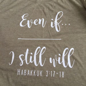 May include: A green t-shirt with white text that reads "Even if... I still will" and "Habakkuk 3:17-18".