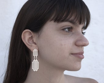 Long geometric handmade earrings of silver in architectural design