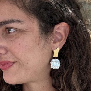 Geometric handmade silver stud earrings with dangling square pearl beads