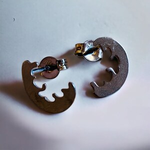 Special and abstract handmade unisex silver stud earrings