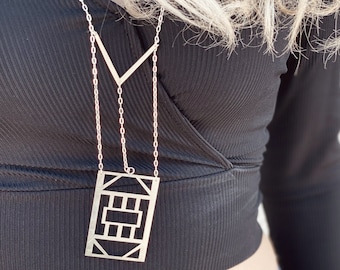 Contemporary minimal and geometric handmade long silver pendant