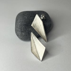 Triangular and geometric handmade silver stud earrings in 3D effect origami design