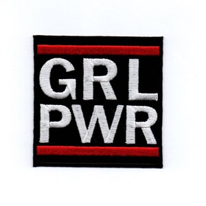 May include: Black and white embroidered patch with red trim. The patch says "GRL PWR" in white letters.