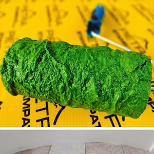 May include: A green textured paint roller for creating a faux stone finish on walls. The roller is made of a soft, flexible material and is designed to create a realistic stone effect.