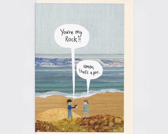 May include: A greeting card featuring a collage of a beach scene with two figures. One figure holds a small brown object, with speech bubbles reading: You're my Rock!! and umm, that's a poo. The background shows blue ocean waves and sand.