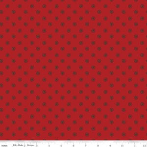 May include: Red fabric with a repeating pattern of small, dark gray circles. The circles have a stylized design resembling a wheel with spokes.