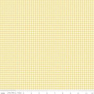 May include: A fabric with a yellow and white gingham pattern. The pattern is a repeating grid of squares. The image includes a ruler along the bottom edge, with the word "Inches" and the text "Riley Blake Designs".