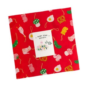 May include: Red fabric square with a repeating pattern of whimsical food and animal illustrations. Includes a tag that reads "MERRY HAPPY" and "RUBY STAR SOCIETY". The illustrations include a fried egg, mushroom, and a bear.