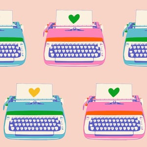 May include: A repeating pattern of colorful typewriters in pink, blue, and green, each with a heart-shaped symbol on the paper. The keyboards are white with blue keys, and the background is a light pink.