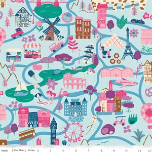 May include: A light blue fabric featuring a repeating pattern of colorful travel-themed illustrations including the Eiffel Tower, Big Ben, a windmill, a castle, a sailboat, a double-decker bus, and a hot air balloon, with a 12-inch ruler at the bottom.