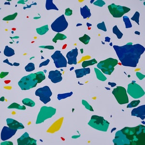 May include: Abstract pattern with blue, green, yellow, and red paint splatters on a white background.