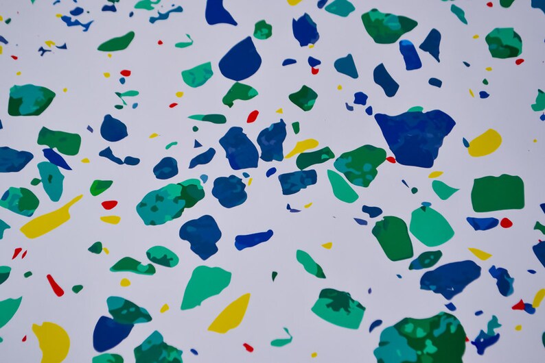 May include: Abstract pattern with blue, green, yellow, and red paint splatters on a white background.