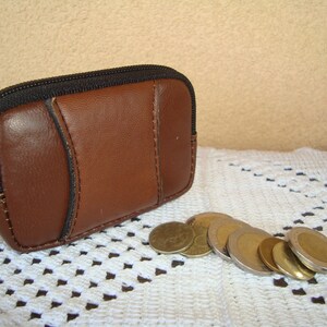 NEVER USED,A penny purse, a belt purse, a zipper purse,   a small leather purse,Leather