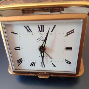 1960s Starlet travel alarm clock in perfect working order