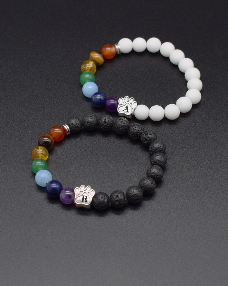 Personalized pet memorial bracelets with engraved paw initial, Rainbow Bridge stones, lava and matte agate beads.