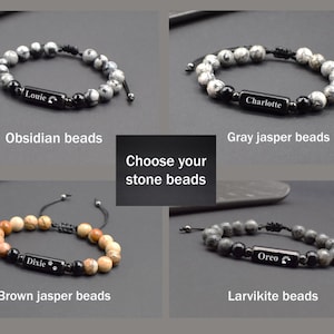 May include: Four different types of beaded bracelets with personalised nameplates. The bracelets feature obsidian, grey jasper, brown jasper, and larvikite beads.