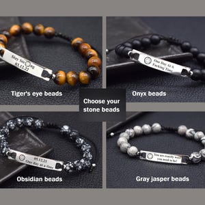 May include: Four adjustable bracelets featuring metal bars with engraved text and symbols. One has brown tiger's eye beads, one has matte black onyx beads, one has black and white obsidian beads, and one has grey jasper beads with black cord ties.
