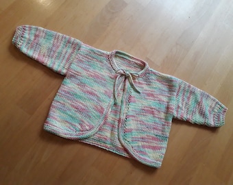 Knitted baby vest.