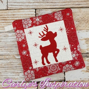 May include: Red and white quilted pot holder with a red reindeer silhouette in the center. The pot holder has a loop for hanging.