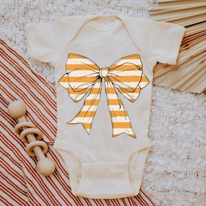 Coquette Bow PNG: Orange Striped Halloween Shirt Design (Commercial Use Allowed