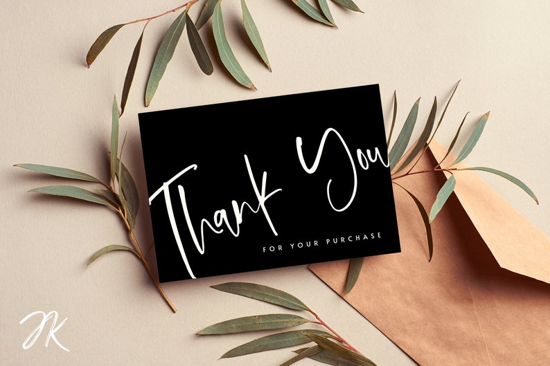 May include: A black card with white script that says "Thank You" and "For Your Purchase". The card is surrounded by green eucalyptus leaves.
