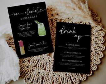 May include: Two black rectangular menu cards with white text. The left card lists non-alcoholic beverages including frozen kiwi sparkler and fruit smoothie. The right card lists drink up options including blushing bride, citrus sparkler, and old fashioned gin.
