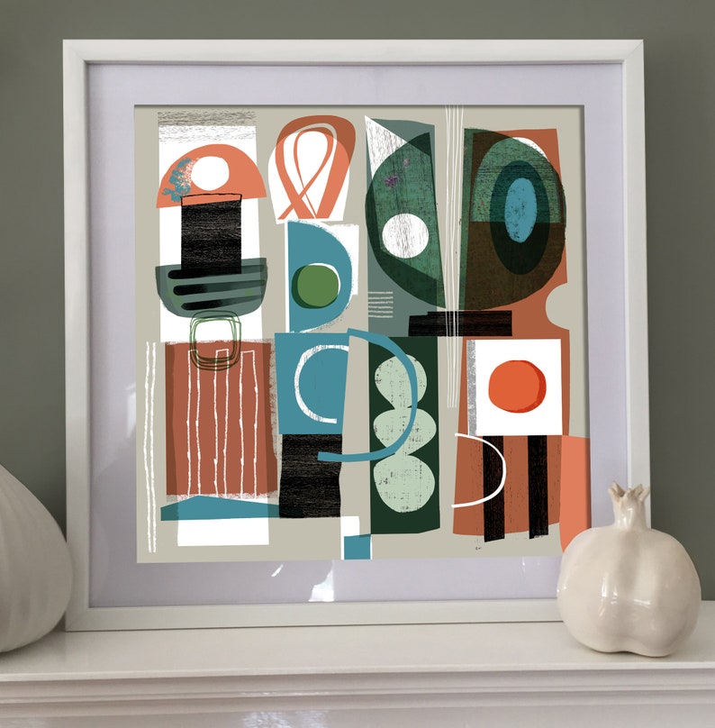 May include: Abstract art print featuring geometric shapes in shades of green, blue, red, and white. The print is framed in a white frame.