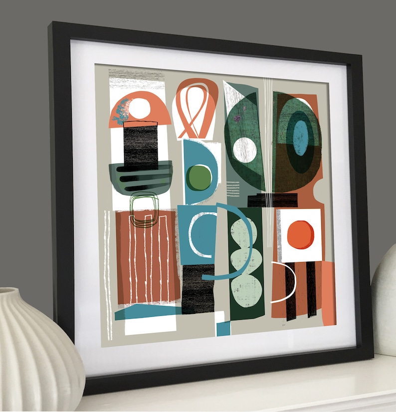 May include: Abstract art print featuring geometric shapes in shades of green, blue, red, and black on a light grey background. The print is framed in black.