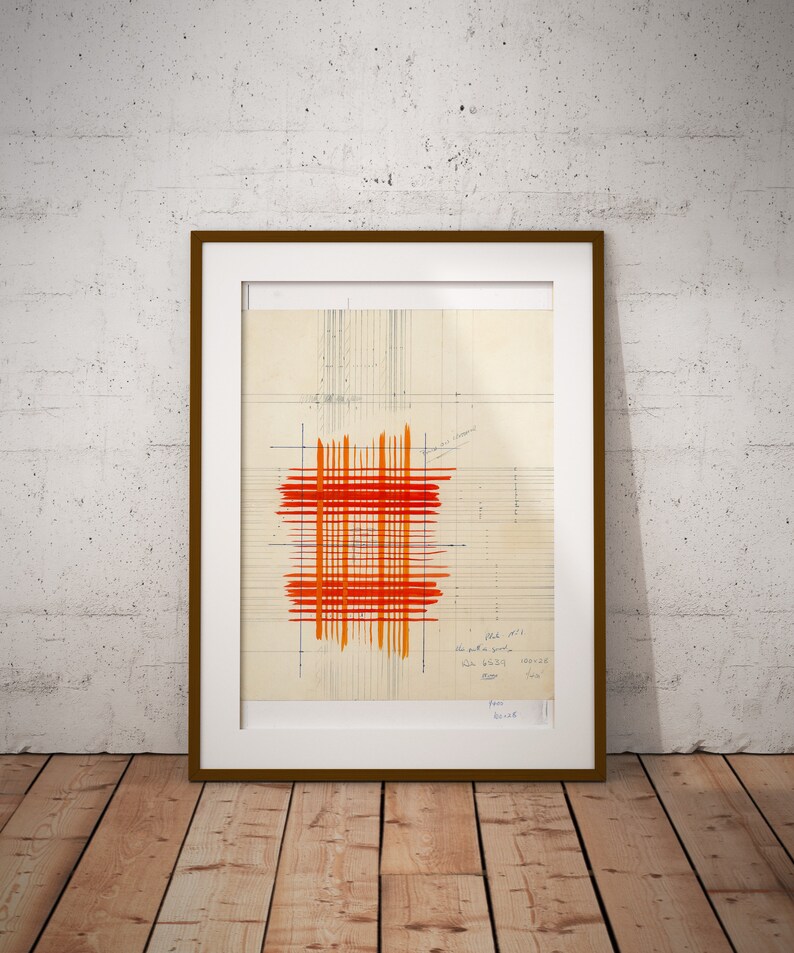 May include: A framed abstract art print featuring a red and orange grid pattern on a beige background. The print includes handwritten text in the bottom right corner.