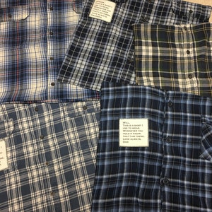 May include: Four plaid shirts with different colored patterns and a handwritten message on each. The messages are: "This is a shirt I use to wear whenever you hold it know that I am there. Love always, Billy", "Well, this is a shirt I use to wear whenever you hold it know that I am there. Love always, Dad", "This is a shirt I use to wear whenever you hold it know that I am there. Love always, Grandpa", and "This is a shirt I use to wear whenever you hold it know that I am there. Love always, Dad".